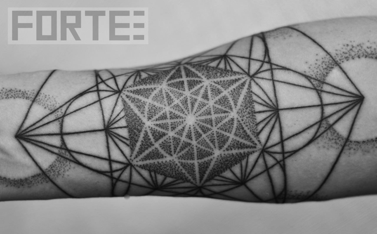 Sacred geometry metatrons cube tattoo on forearm