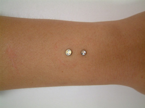 Dual Arm Piercing With Dermal Anchors