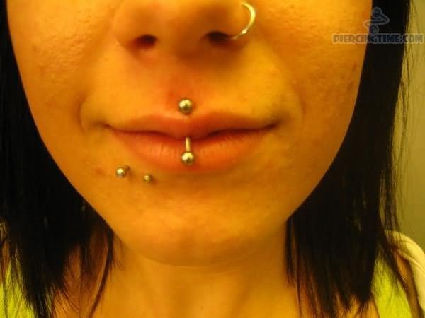 Large Barbell Jestrum Piercing And Nostril Piercing