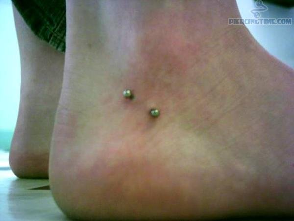 Right Ankle Piercing With Green Barbell