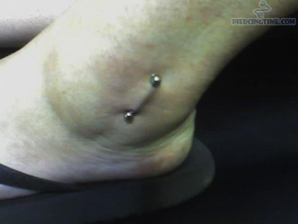 Vertical Ankle Piercing with Silver Barbell