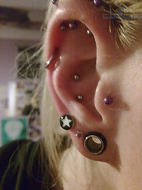 Nice Tragus And Pinna Piercing On Girl Right Ear