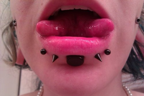 Lower Lip Black Spike Studs And Tongue Splitting Piercing