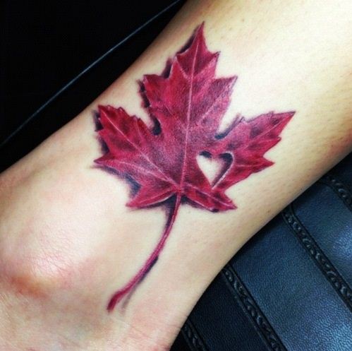 Simple Red Ink Maple Leaf Tattoo On Leg