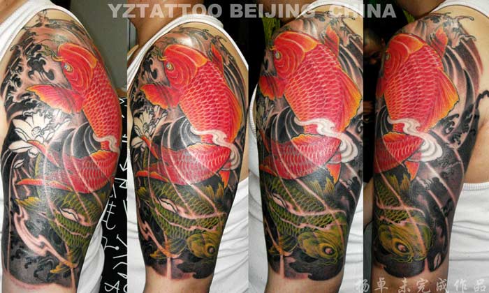 Awesome Two Koi With Flowers Tattoo On Man Left Half Sleeve