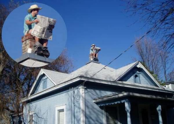 Man Sitting On Chimney Reading Newspaper Funny Picture