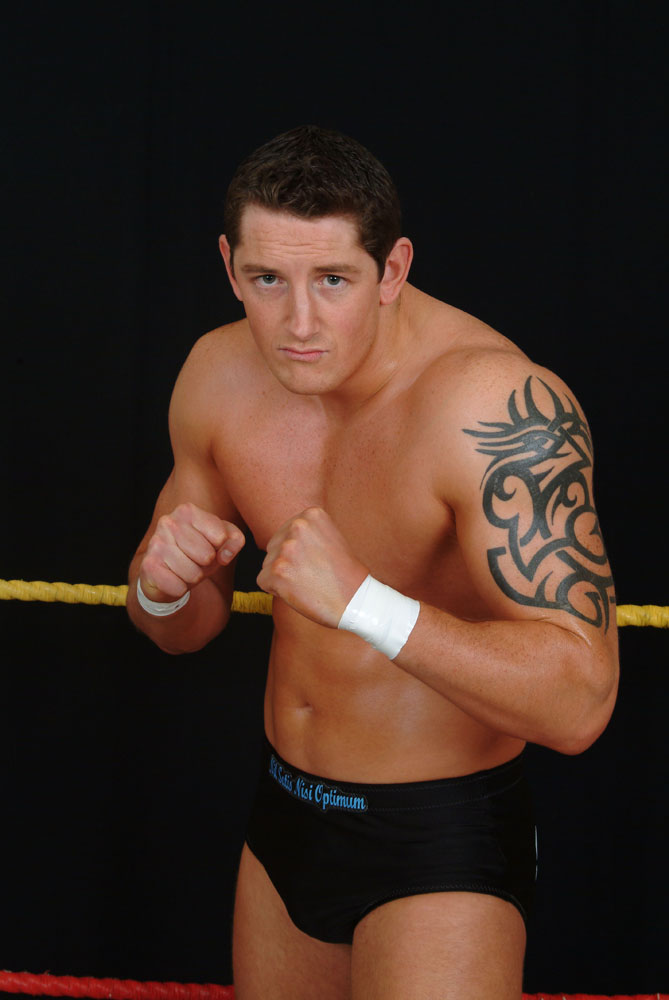 Black Tribal Design Tattoo On Wrestler Wade Barrett Left Half Sleeve