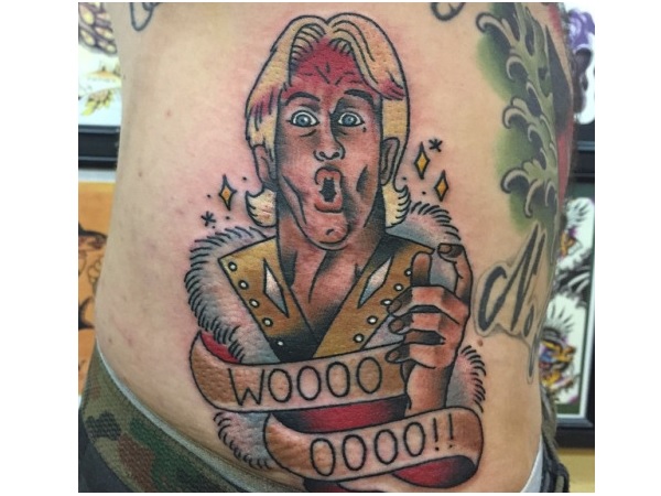 Colorful Ric Flair Wrestler With Banner Tattoo On Side Rib