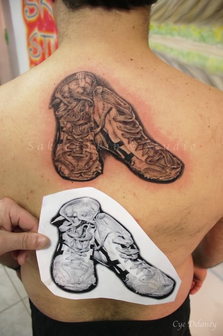 Wrestling Shoes Tattoo On Man Upper Back