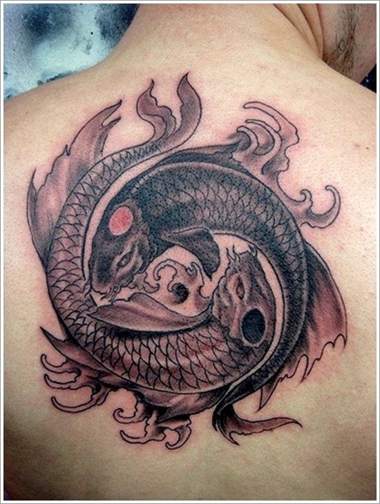 Black Ink Two Carp Fish Tattoo On Upper Back