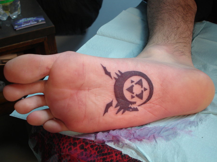 Black Ouroboros And Pentagram Tattoo On Under Foot