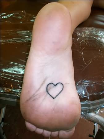 Black Outline Heart Tattoo On Under Foot