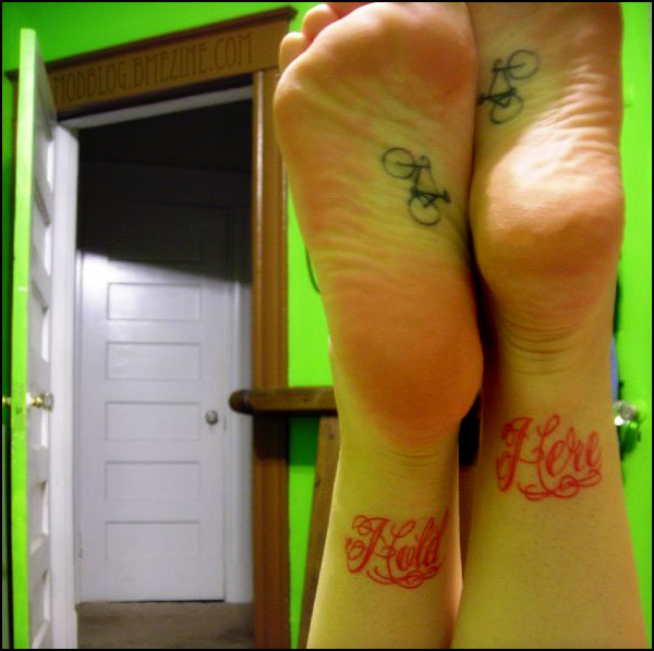 Black Outline Two Cycle Tattoo On Under Feet