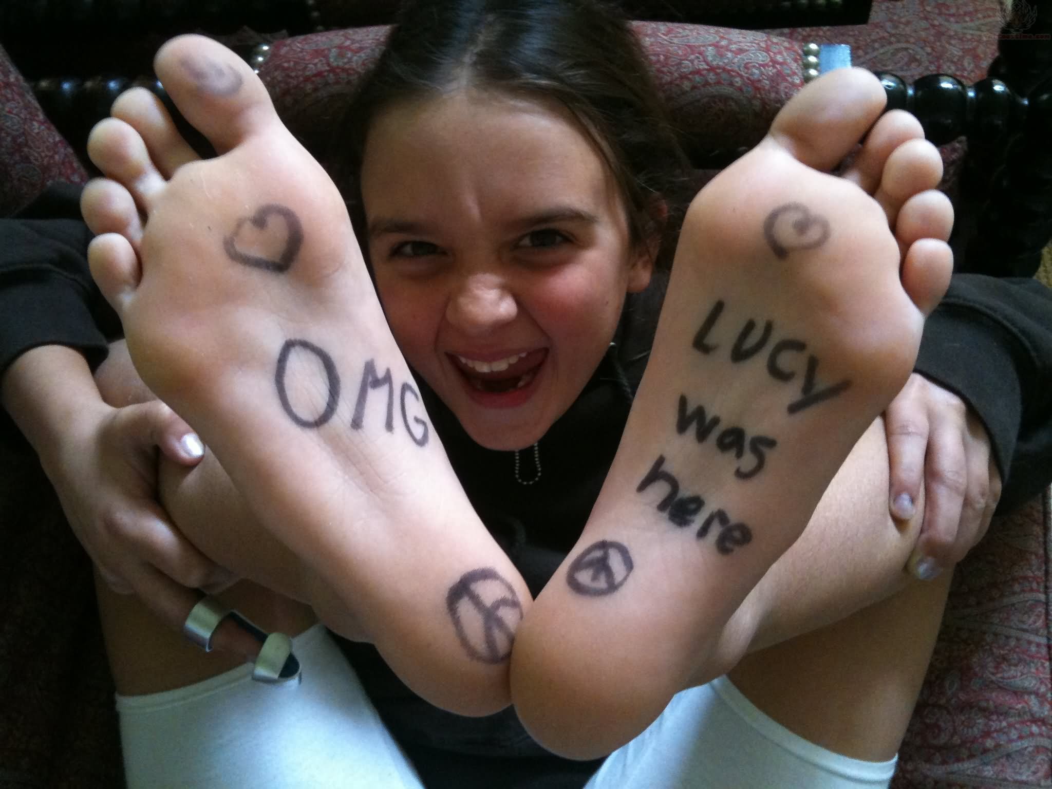 Omg Lucy Was Here Lettering Tattoo On Under Feet