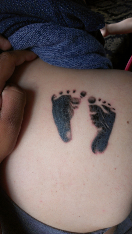 Black Two Footprints Tattoo Design For Side Rib