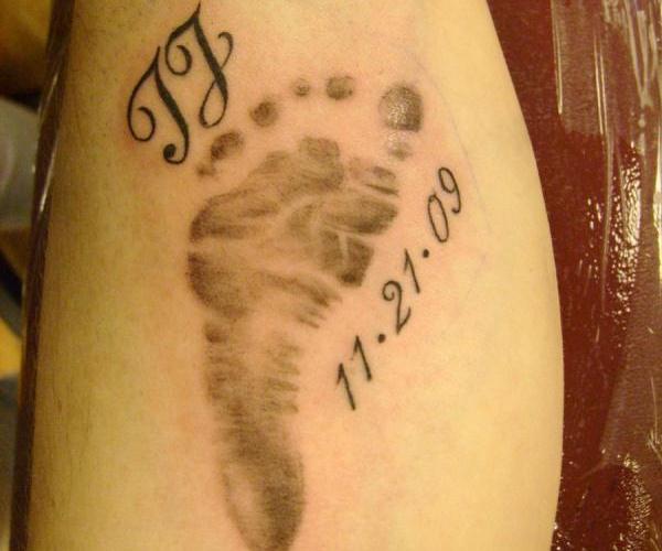 Memorial Black Footprints Tattoo Design For Leg Calf