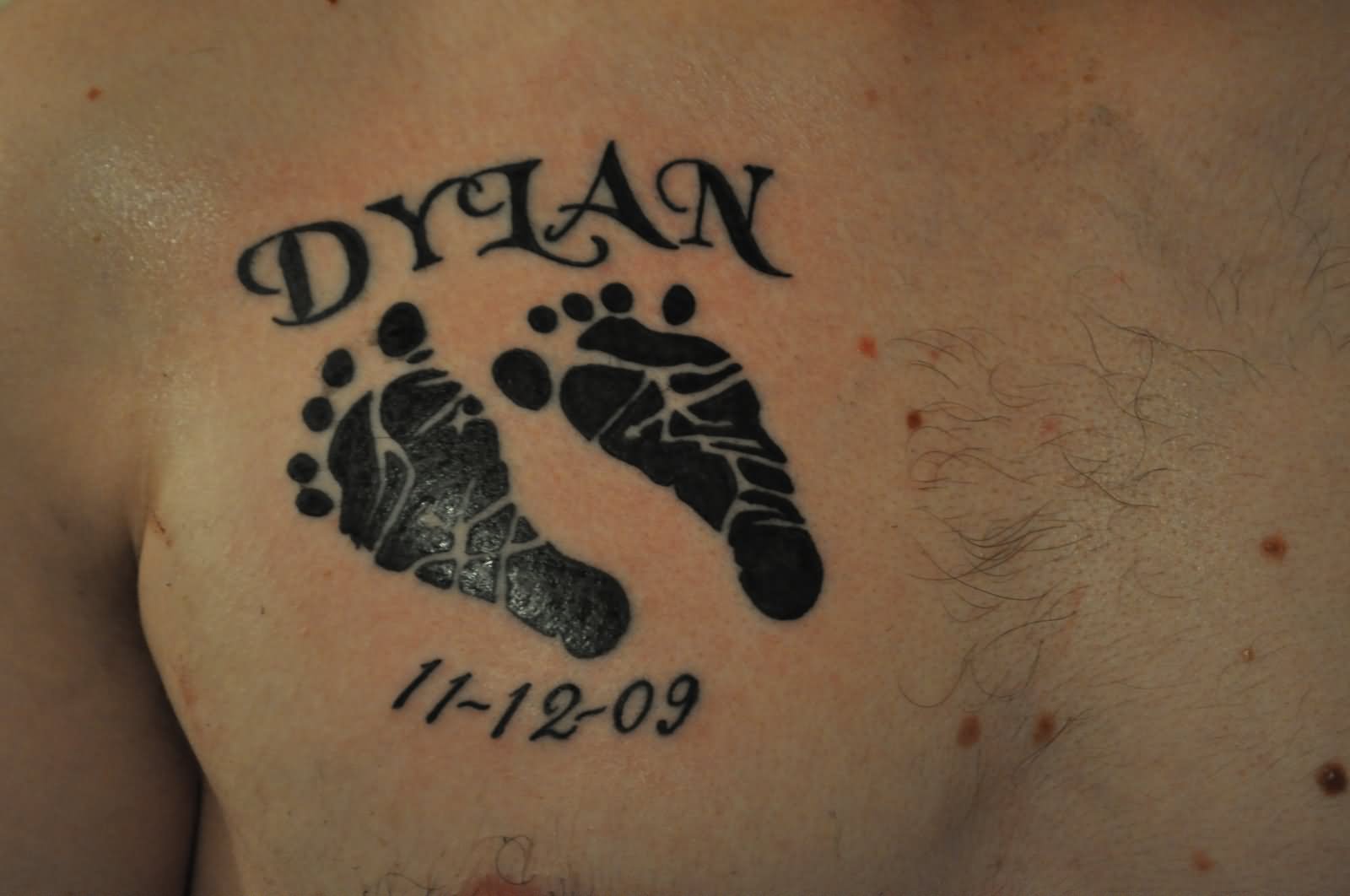 Memorial Black Footprints Tattoo On Chest