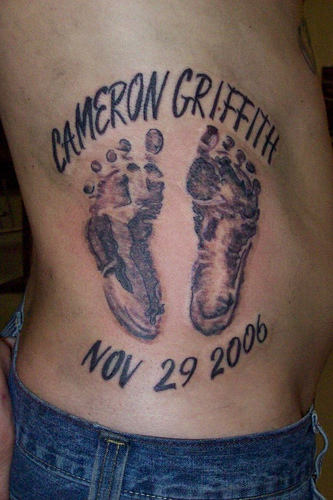 Memorial Black Footprints Tattoo On Side Rib