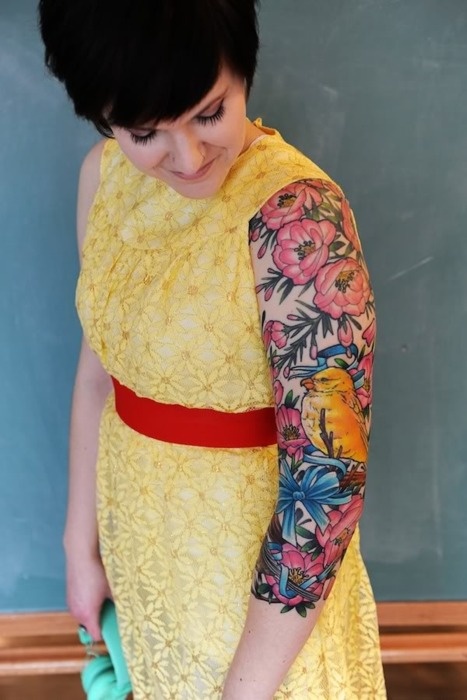 Colorful Floral With Bird Tattoo On Girl Left Sleeve