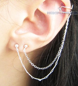 Double Chain Piercing On Girl Left Ear