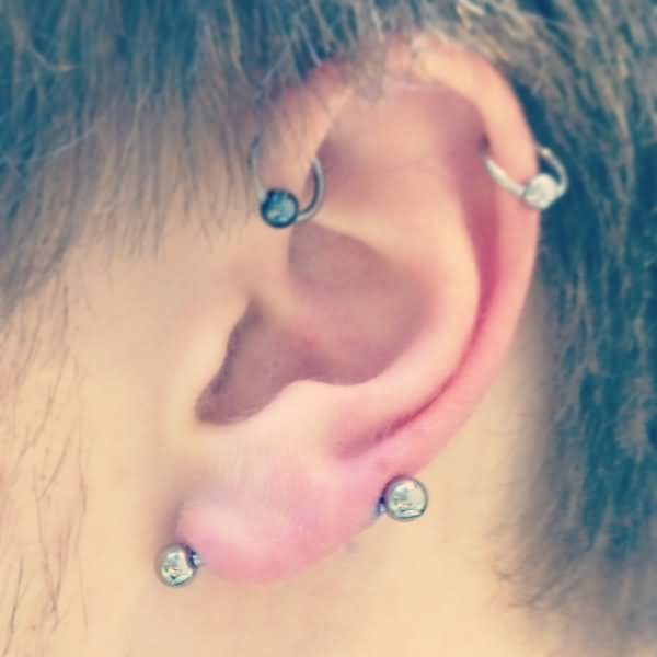 Horizontal Anti Lobe Piercing On Left Ear