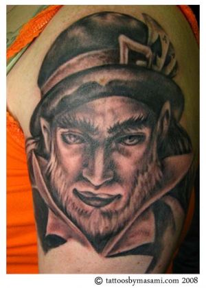 Leprechaun Face Tattoo On Left Half Sleeve