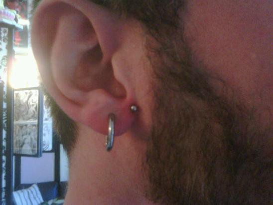 Man With Anti Lobe Piercing On His Right Ear