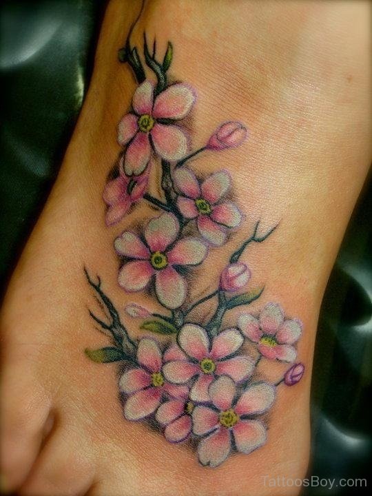 Pink And White Floral Tattoo On Foot