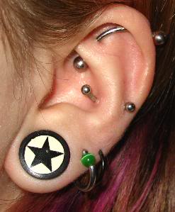 Star Stud Lobe And Anti Lobe Piercing On Girl Left Ear