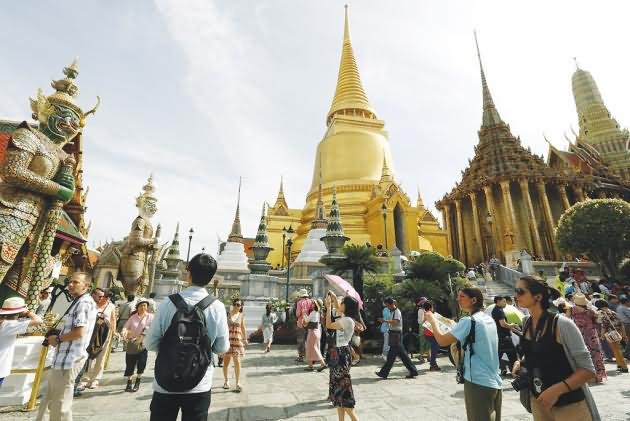 Tourists Sightseeing At Wat Phra Kaew Emerald Buddha Temple Inside Grand Palace