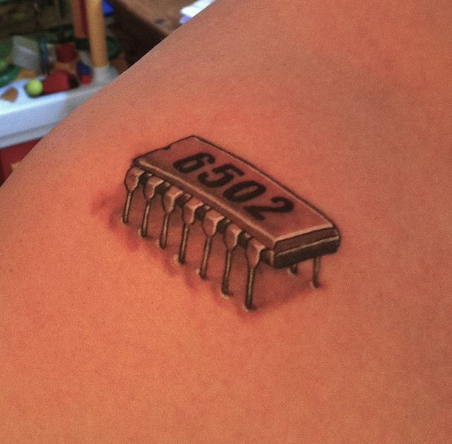 Small Chip Tattoo On Shoulder