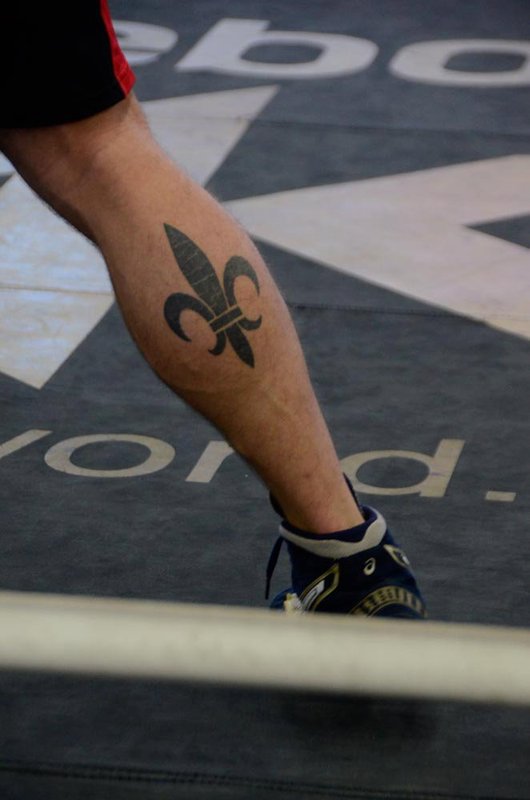 Black Ink Fleur De Lis Tattoo On Leg Calf