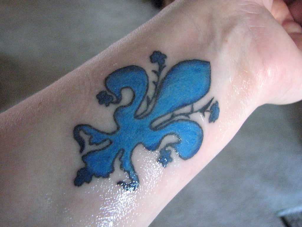 Blue Ink Fleur De Lis Tattoo On Left Forearm