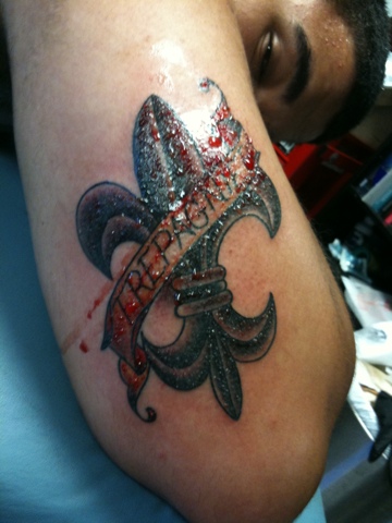 Fleur De Lis Tattoo With Banner On Arm