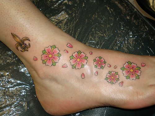 Flowers And Fleur De Lis Tattoo On Foot And Leg