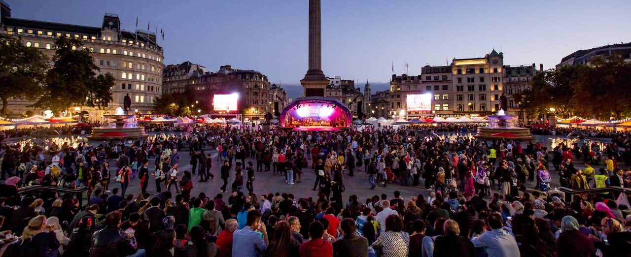 Large Number Of People At Trafalgar Square During Night Picture