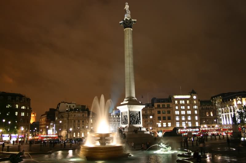 Nelson's Column And Fountain At Night In Trafalgar Square