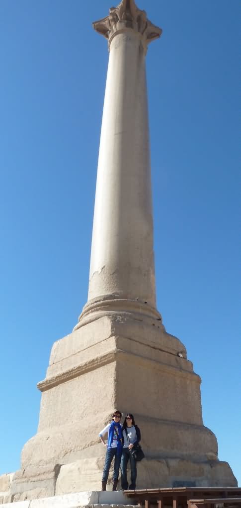 Girls Posing For Photo With Pompey's Pillar In Alexandria