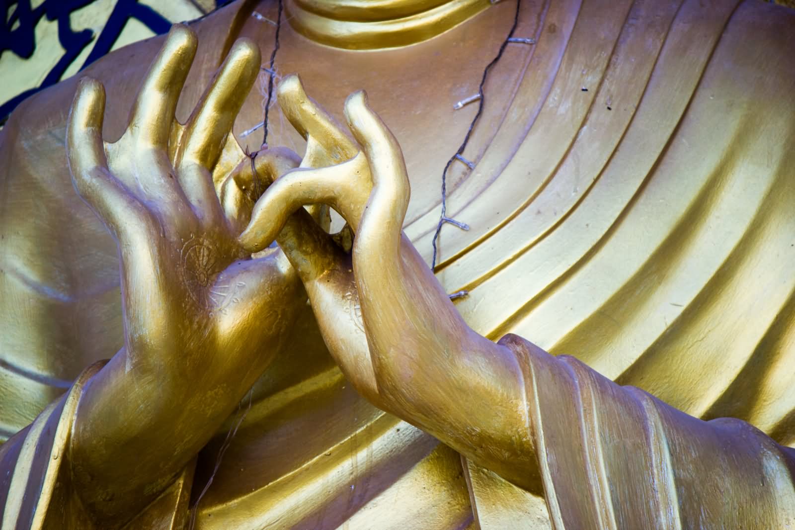 Closeup Of Lord Budha Golden Statue At Shanti Stupa