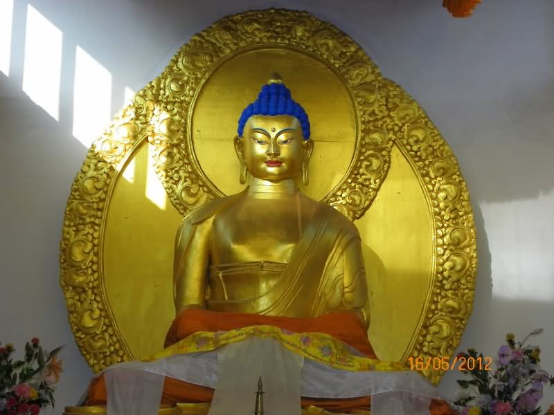 Front View Of Lord Buddha Golden Statue Inside The Shanti Stupa