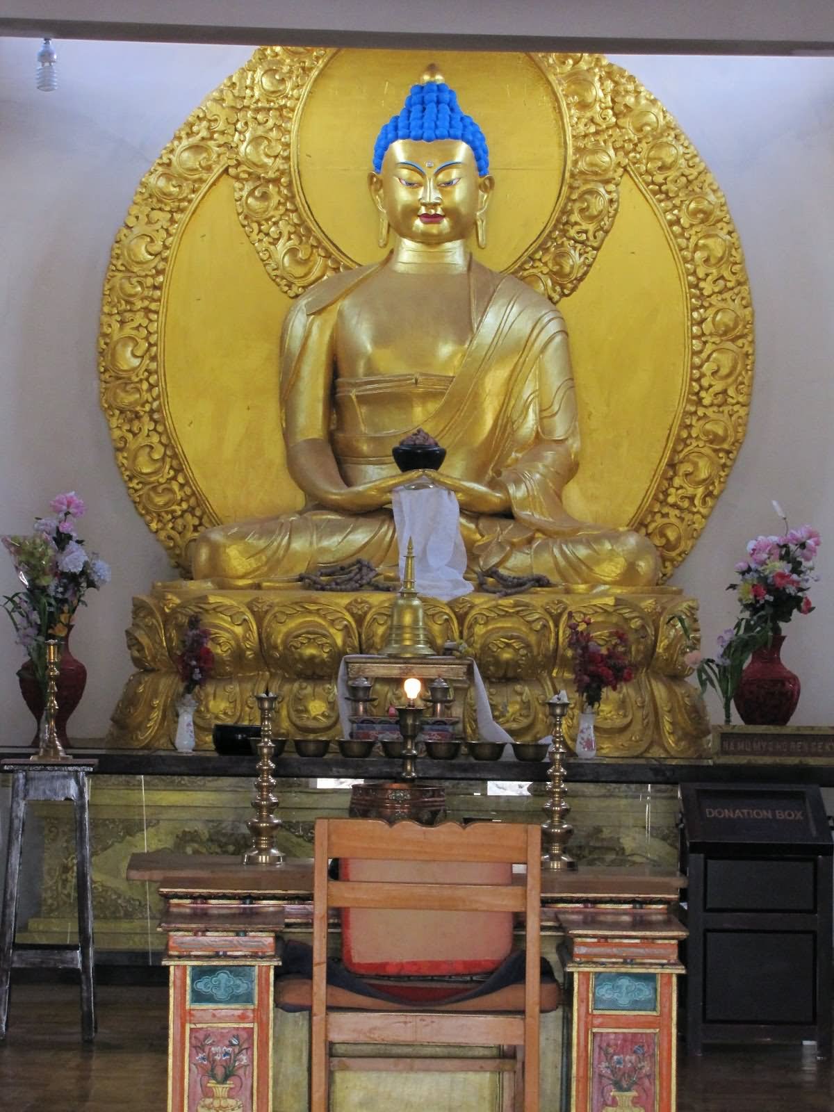 Golden Lord Buddha Statue Inside Meditation Hall Of Shanti Stupa