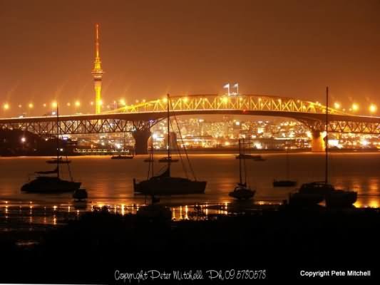 Sky Tower And Auckland Harbour Bridge At Night