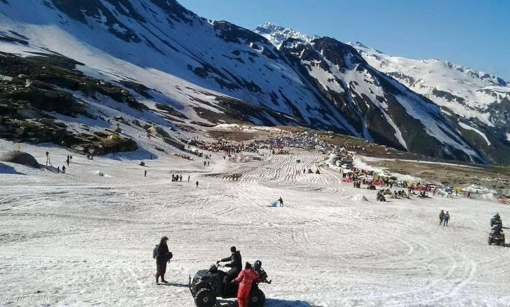 Tourists Enoying With Snow Scooters At Rohtang Pass Valley