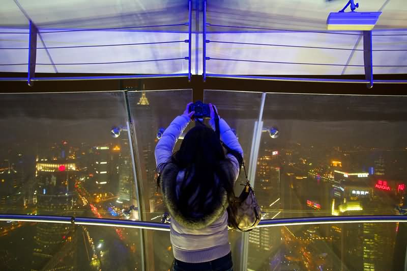 Girl Enjoying Outside View From The Oriental Pearl Tower At Night