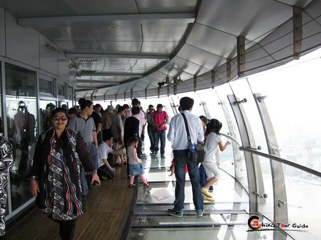 Tourists Enjoying Outside View Of Shanghai City From The Oriental Pearl Tower