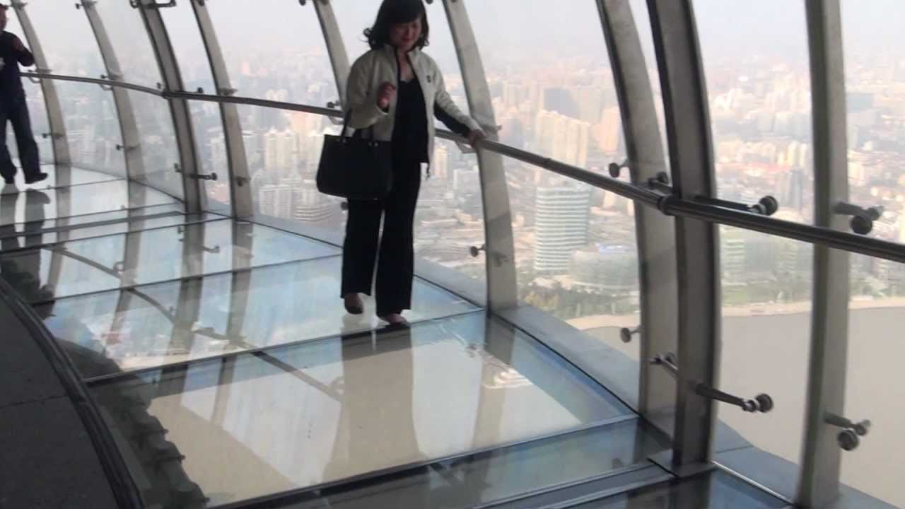 Woman Walking on Glass Floors Inside The Oriental Pearl Tower