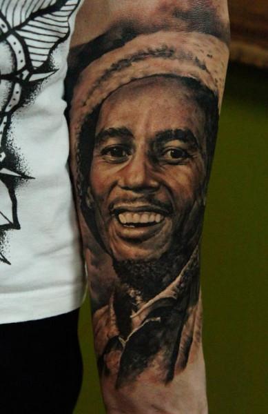 Dark Ink Bob Marley Portrait Tattoo On Forearm