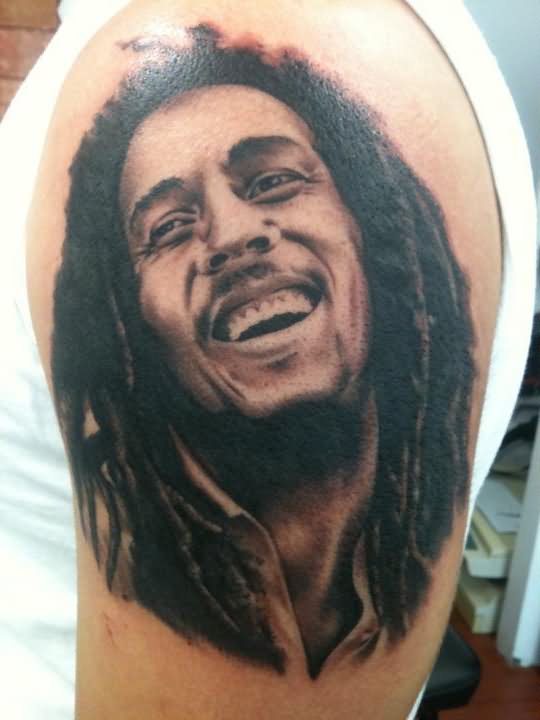 Laughing Bob Marley Portrait Tattoo On Left Shoulder