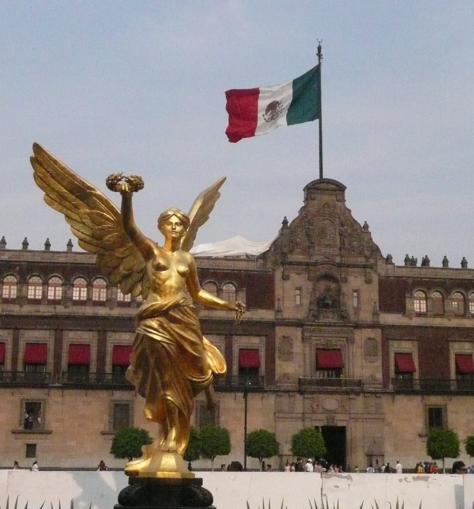 Mexican Flag Behind The Angel Of Independence