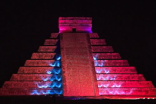 The El Castillo Lit Up With Pink Lights At Night